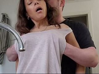 Horny wife gets fucked in the kitchen while doing the dishes