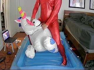 Inflatable toy ride to cum in red latex catsuit